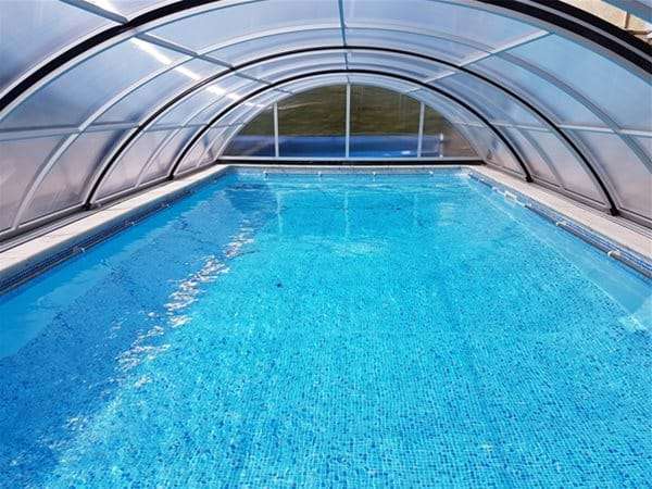 AQBox pool enclosure over one piece swimming pool.