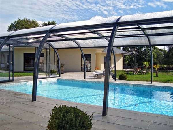one piece swimming pool with endless summer pool enclosure.