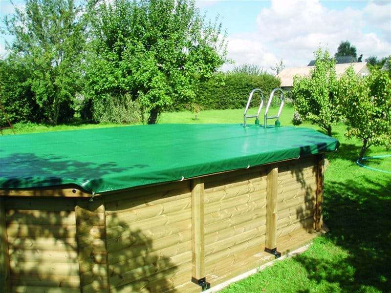 above ground wooden swimming pool, with pool cover.