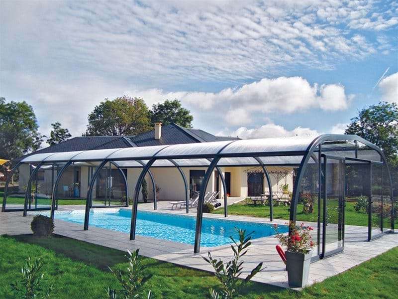 endless summer pool enclosure covering a one piece swimming pool.