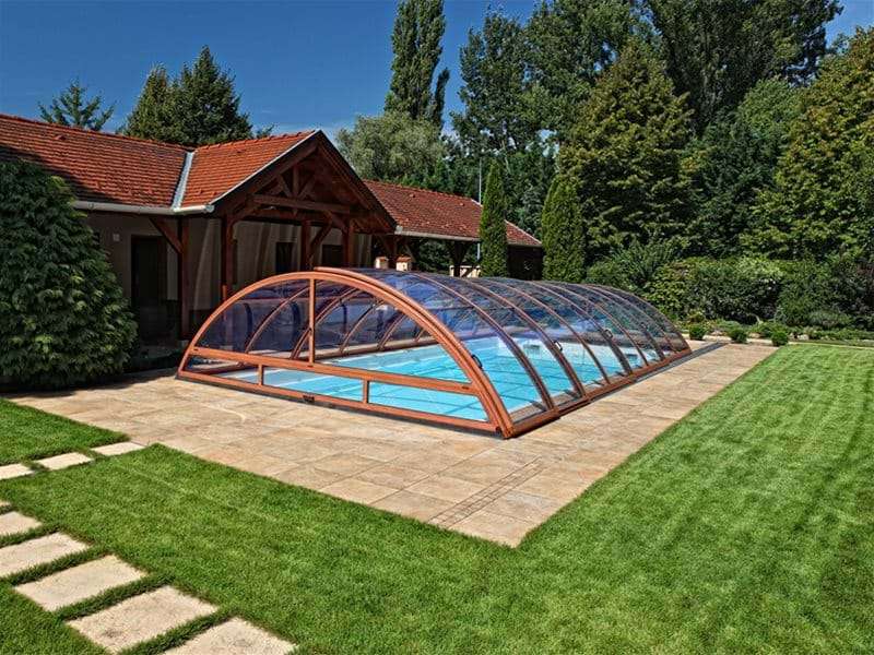 sun or sky pool enclosure covering a one piece swimming pool.