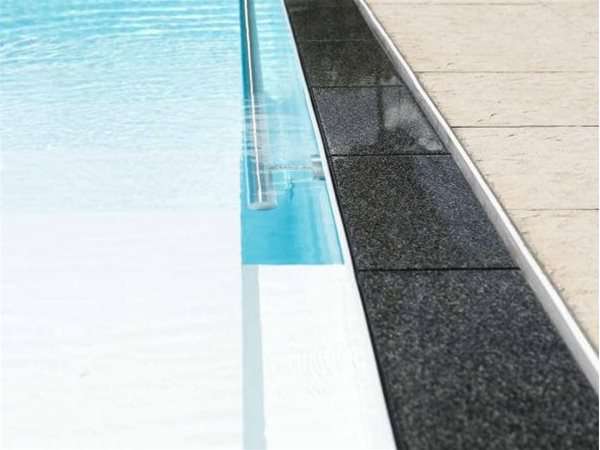 close up of overflow multi one piece swimming pool.