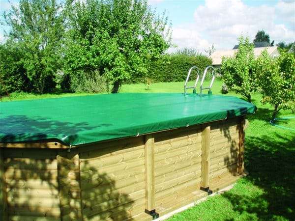 wooden swimming pool with pool cover.