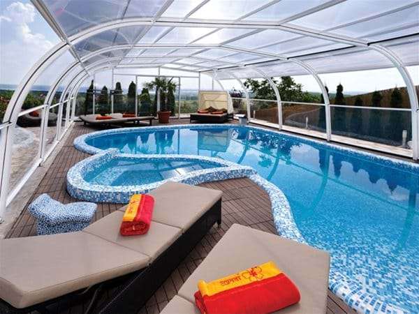 endless summer pool enclosure over swimming pool.