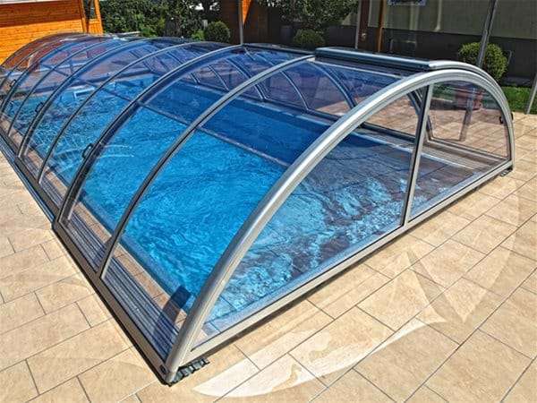 one piece swimming pool with sun or sky pool enclosure.