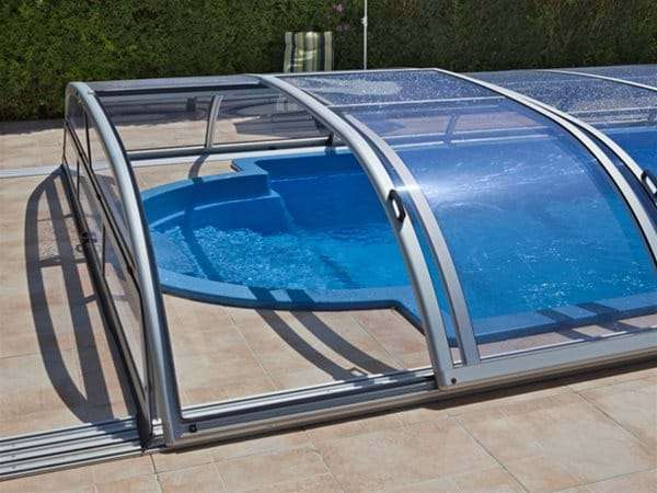 one piece swimming pool with star or star plus pool enclosure slightly open.